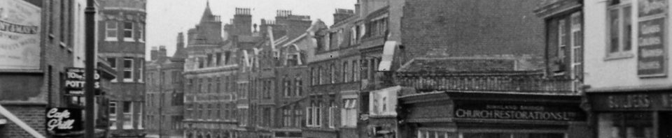 Hampstead: view southward on Heath Street past Underground Station (1955)